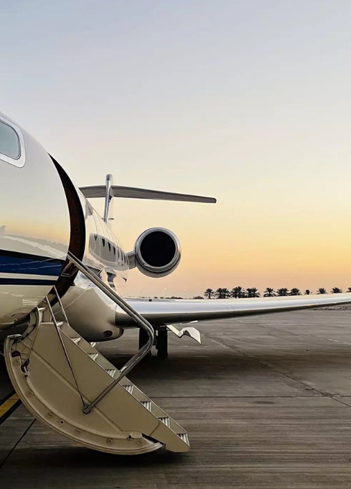 Private jet at sunset